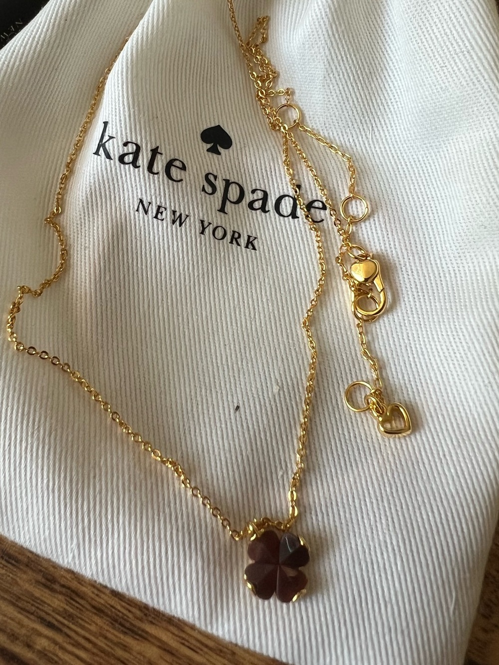 kate spade Gold Necklace with Dark Red Clover Pendant